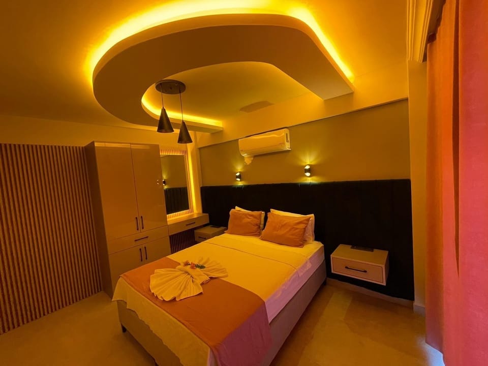 Family Apartment, Balcony, Pool View | Individually decorated, desk, bed sheets