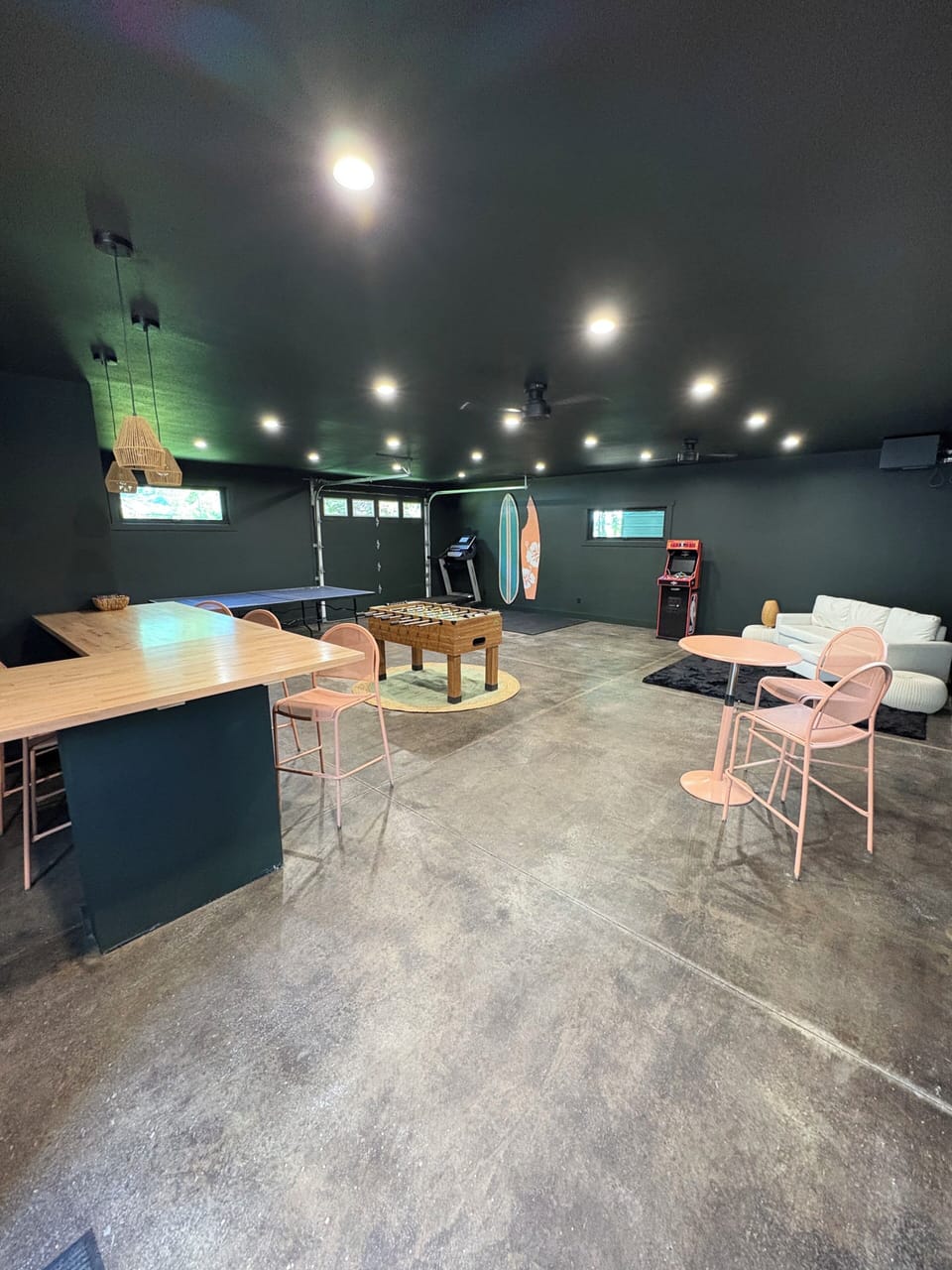 Separate party room with ping pong, foosball and bar area