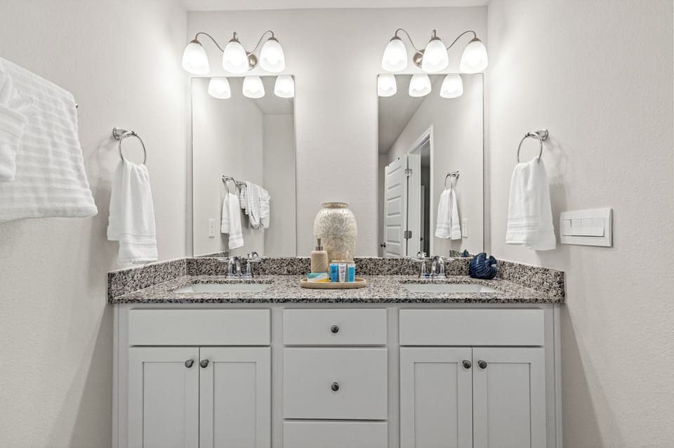 Refresh in the stylish master bath featuring a spacious walk-in shower