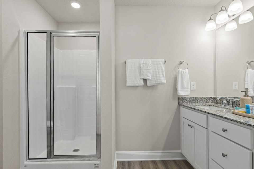 Refresh in the stylish master bath featuring a spacious walk-in shower