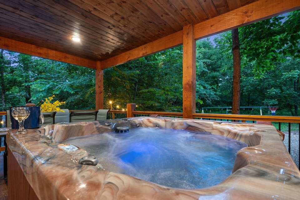 Relax under the stars in your private covered hot tub.