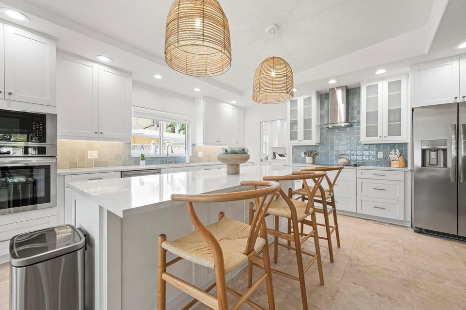 Kitchen island seats 3 and provides extra countertop space