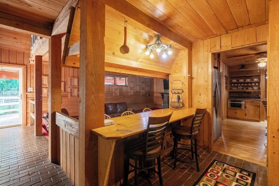 Well-stocked kitchen paired with a stylish bar