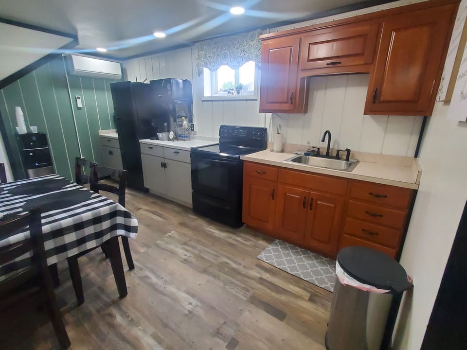 kitchen w/oven, fridge, microwave, air fryer, water cooler