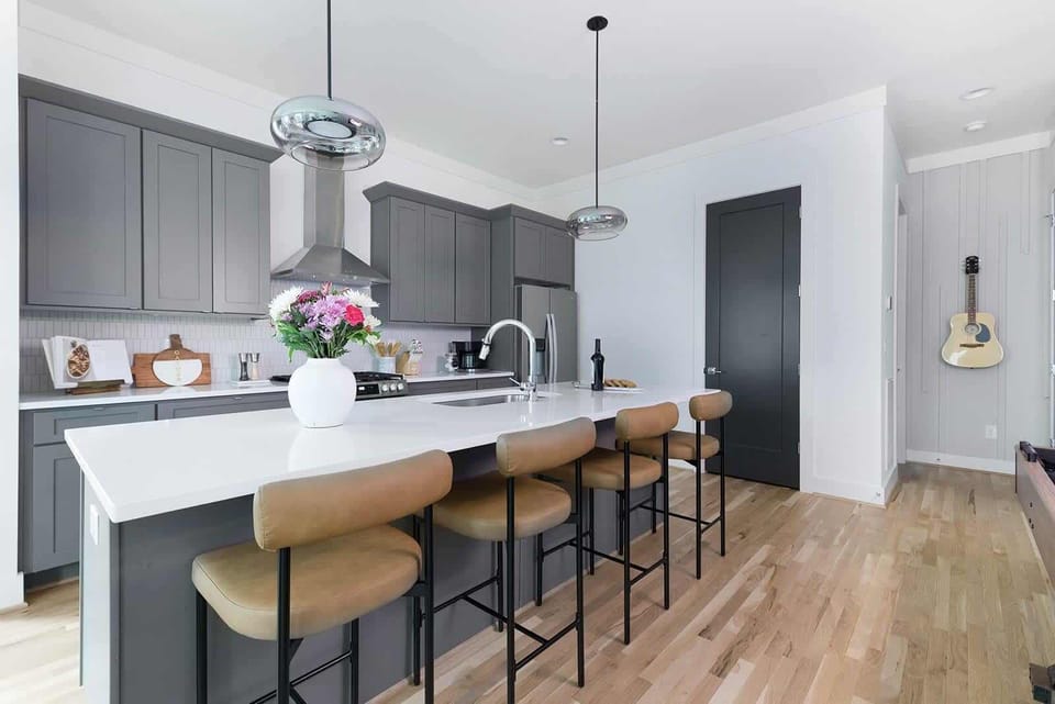 The Acoustic - Clean and spacious kitchen ft. large island with seating. 