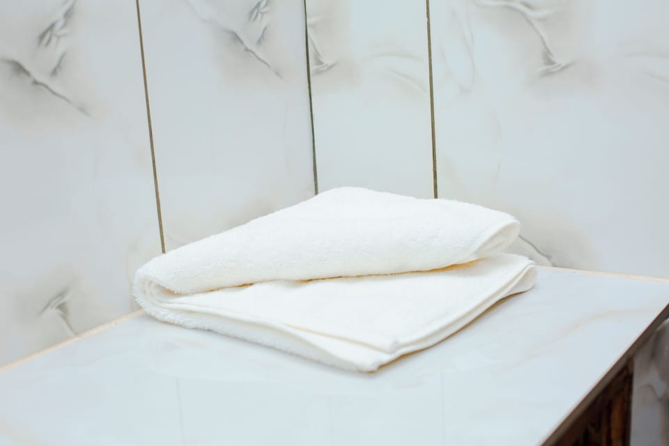 Shower, slippers, towels, soap