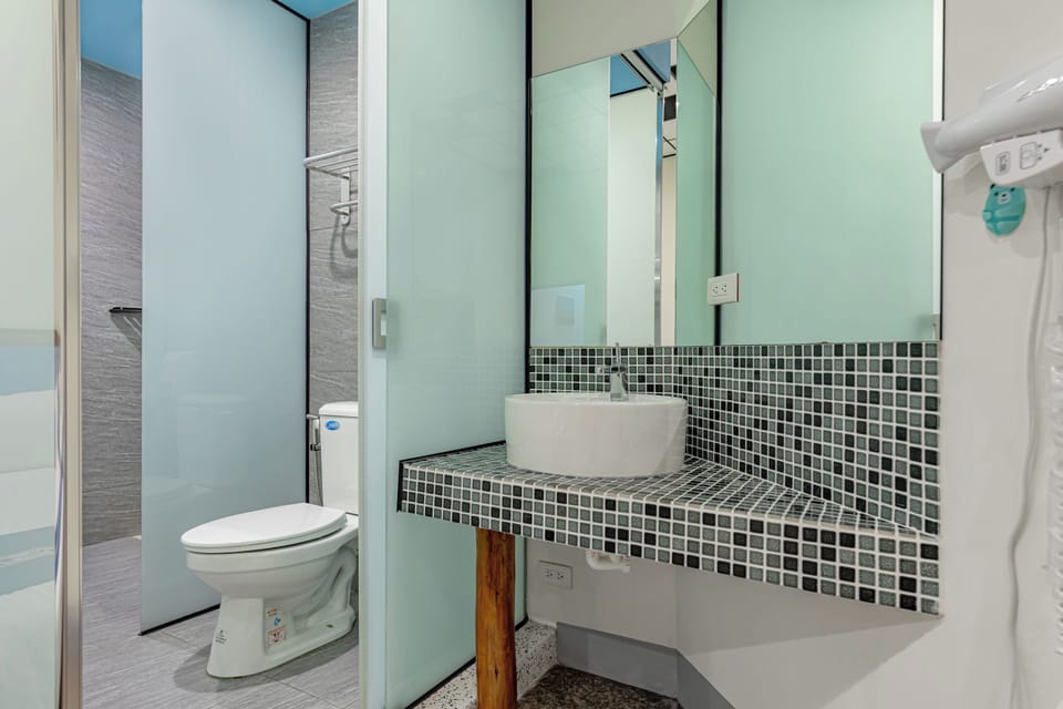 Superior Quadruple Room | Bathroom | Shower, hair dryer, slippers, towels