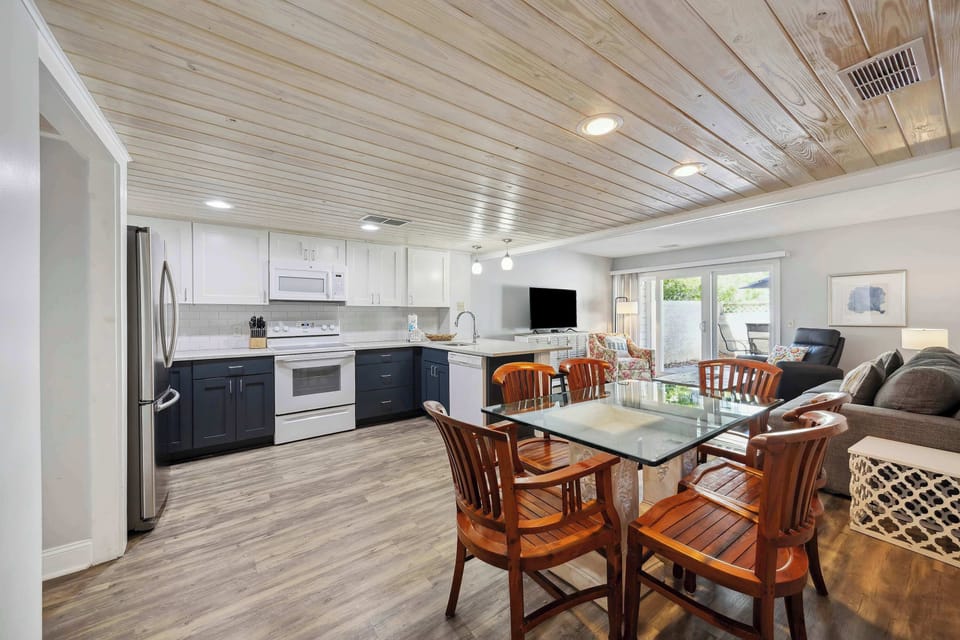 Fully stocked kitchen with cookware and dishware