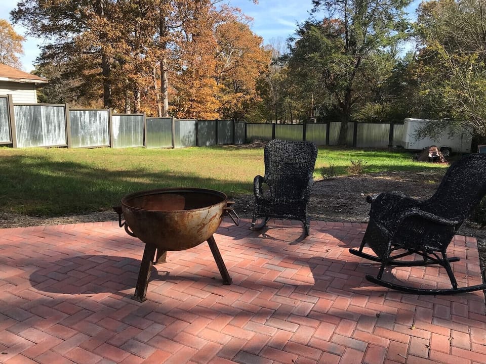 Patio, fire pit, and back yard.