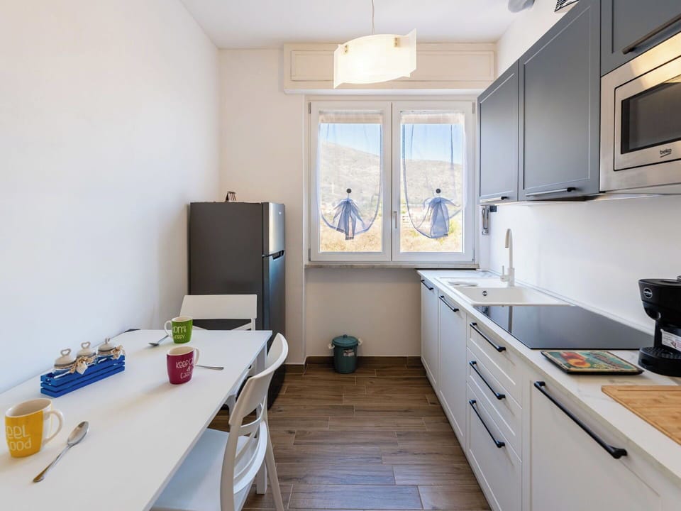 Kitchen, Kitchen Appliance, Countertop, Major Appliance, Furniture, Interior Design, Wood, Cabinetry, Flooring, Kitchen Stove