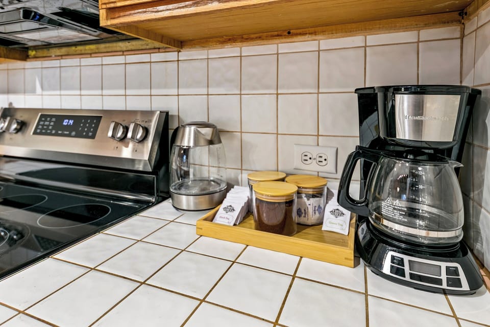 Wake up to fresh coffee in your fully equipped kitchen, complete with modern appliances and thoughtful touches for a perfect morning routine.