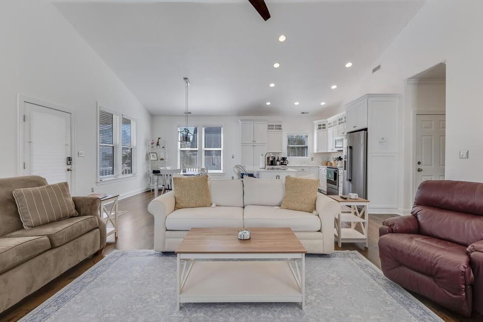 Relax in your bright, open living space with comfortable seating and a fully equipped kitchen perfect for preparing meals together.
