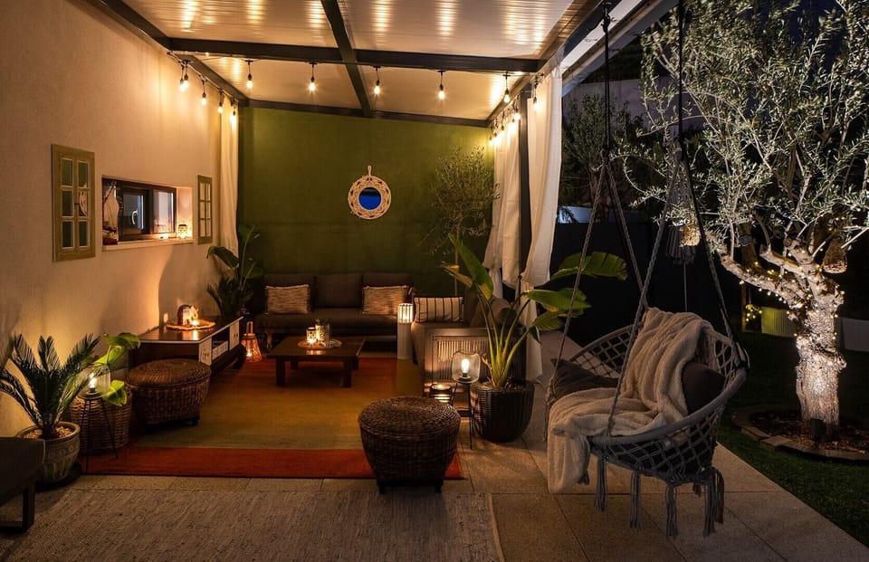 A peaceful haven under warm ambient lights offers a peaceful atmosphere on summer evenings.