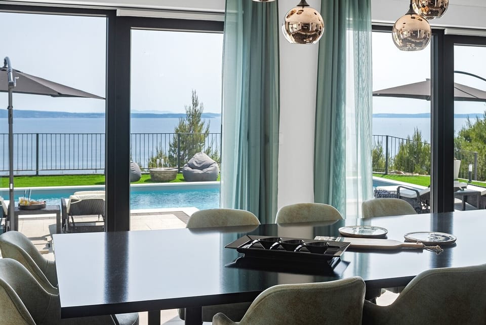 Meticulously decorated spacious dining room with a table for ten people
