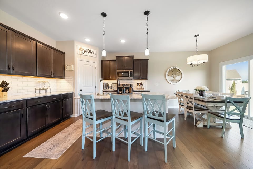 Your spacious open kitchen flows beautifully into the dining area, creating the perfect gathering space for shared meals and conversations.