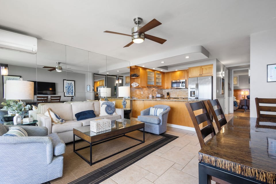 You'll love this bright, open-concept living space with comfortable seating, modern kitchen, and coastal-inspired décor that invites you to unwind and feel right at home.