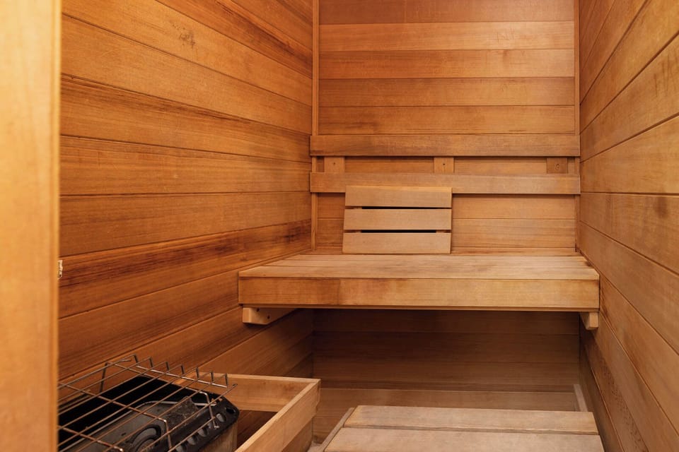 Relax in the warm, wooden sauna, perfect for unwinding after a day at the beach