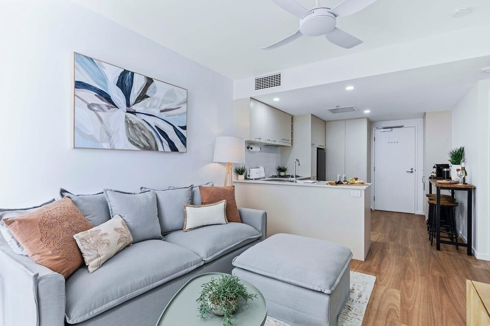 Living room with city views, Smart TV, brand-new interior, and sofa bed.
