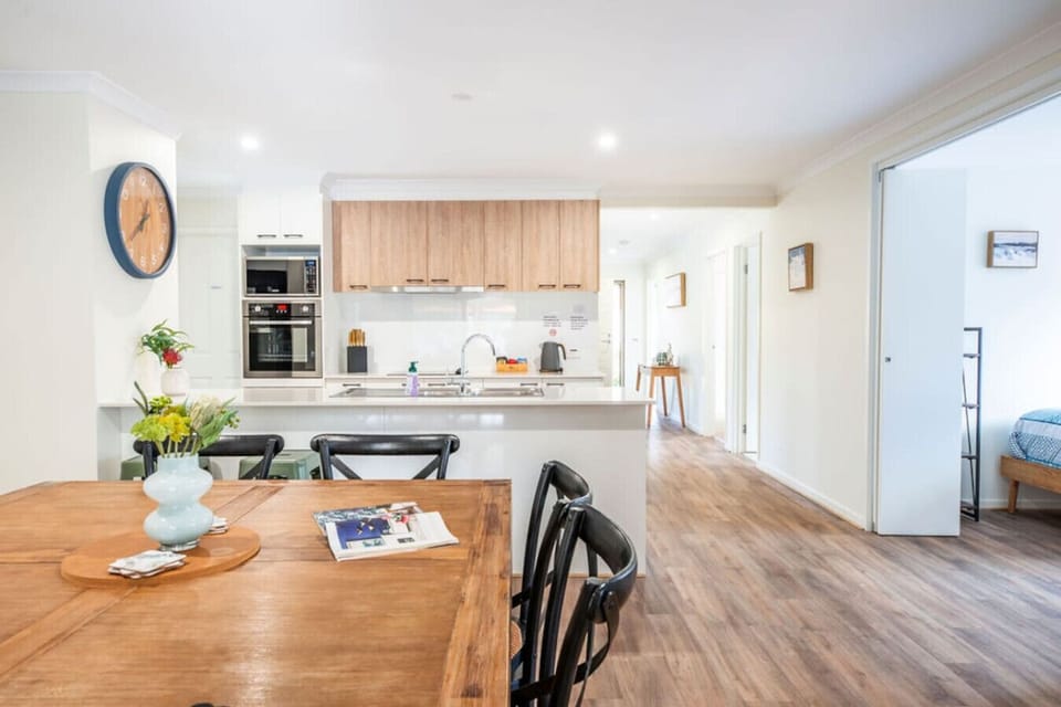Cook and dine with ease in the open-plan kitchen and dining space.