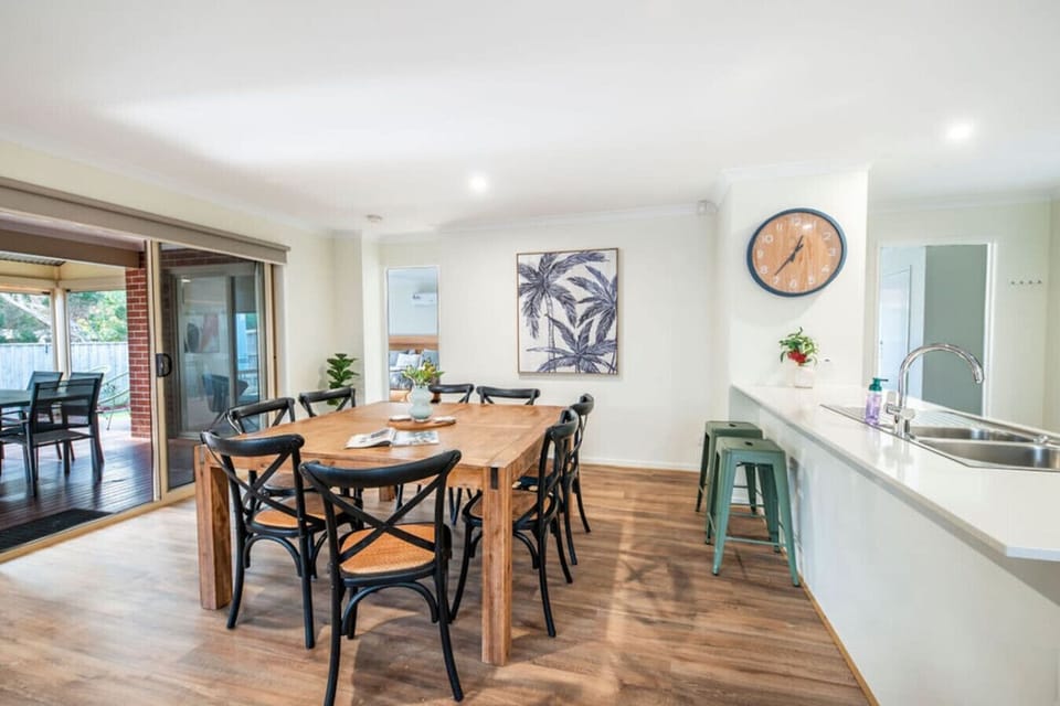 Share memorable meals at the elegant 8-seater dining table, flowing effortlessly from the kitchen to the outdoor balcony for easy entertaining.