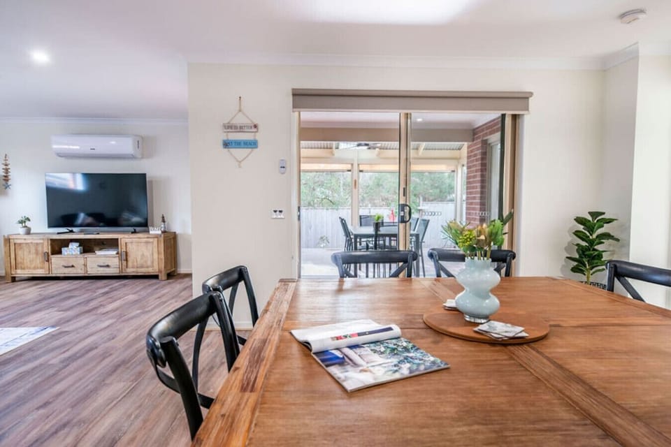 Dining area flows to balcony and living for effortless entertaining.
