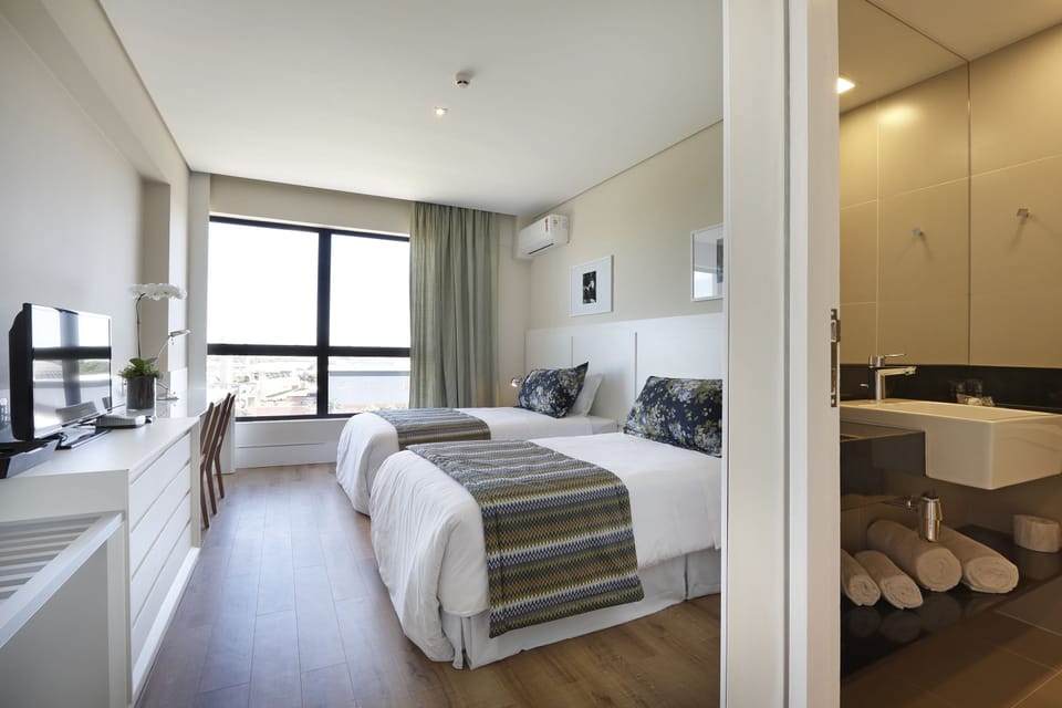 Standard Room, 2 Twin Beds | Minibar, in-room safe, desk, laptop workspace