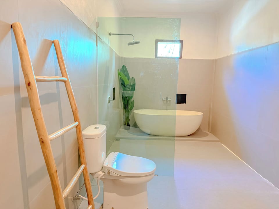 Superior Suite, Park View | Bathroom | Hair dryer, slippers, towels, soap