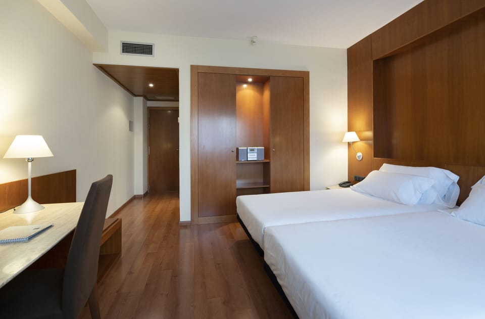 Triple Room | Minibar, in-room safe, desk, iron/ironing board