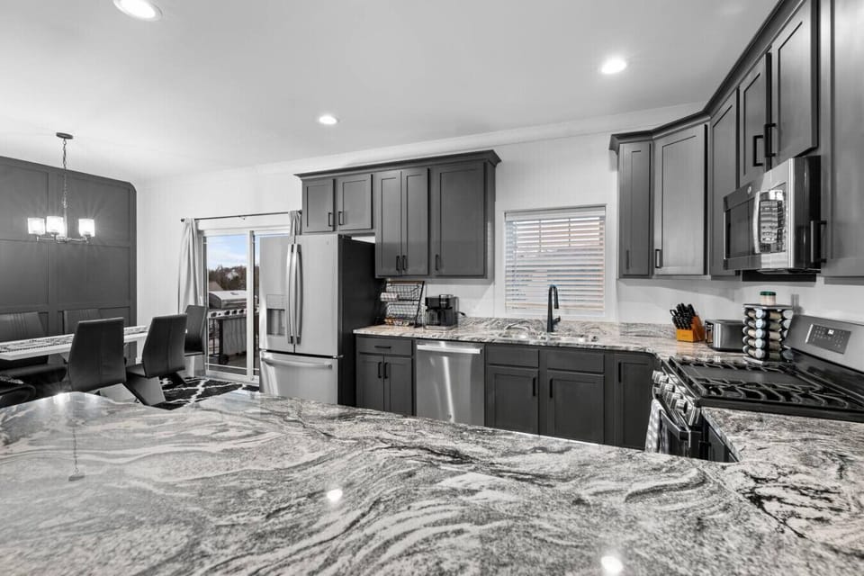 The luxury kitchen with plenty of countertop space, large cabinets and high-end appliances.
