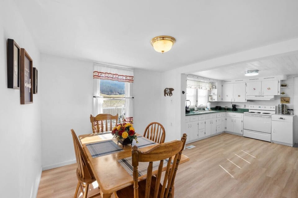 Enter through the kitchen. This includes a dining table with plenty of seating for 4.
