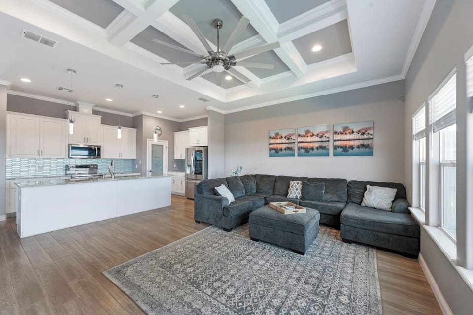 The living room opens to the full kitchen.