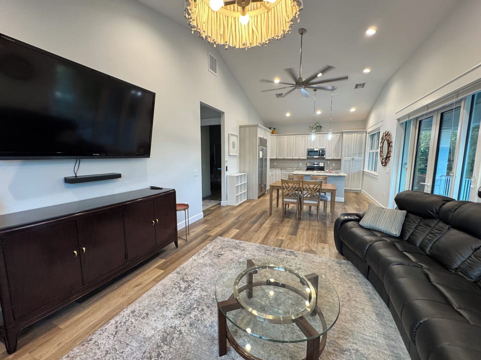 Living room view to dining area and kitchen