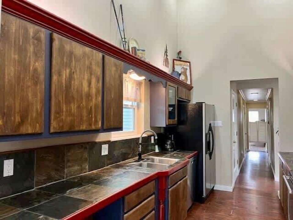 Coffee maker, full-size appliances, and kitchen essentials provided.