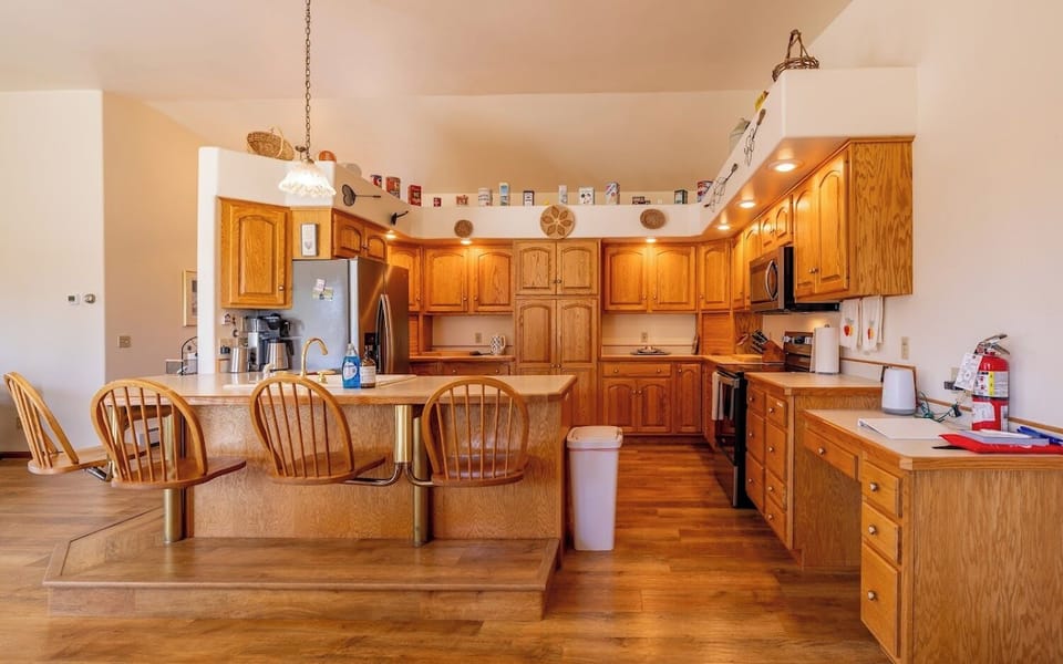 Large kitchen with modern appliances makes preparing meals together enjoyable.