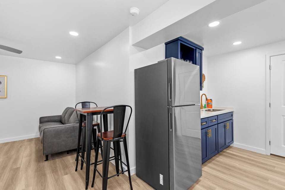 Full-size refrigerator provided and eating area in Downstairs studio