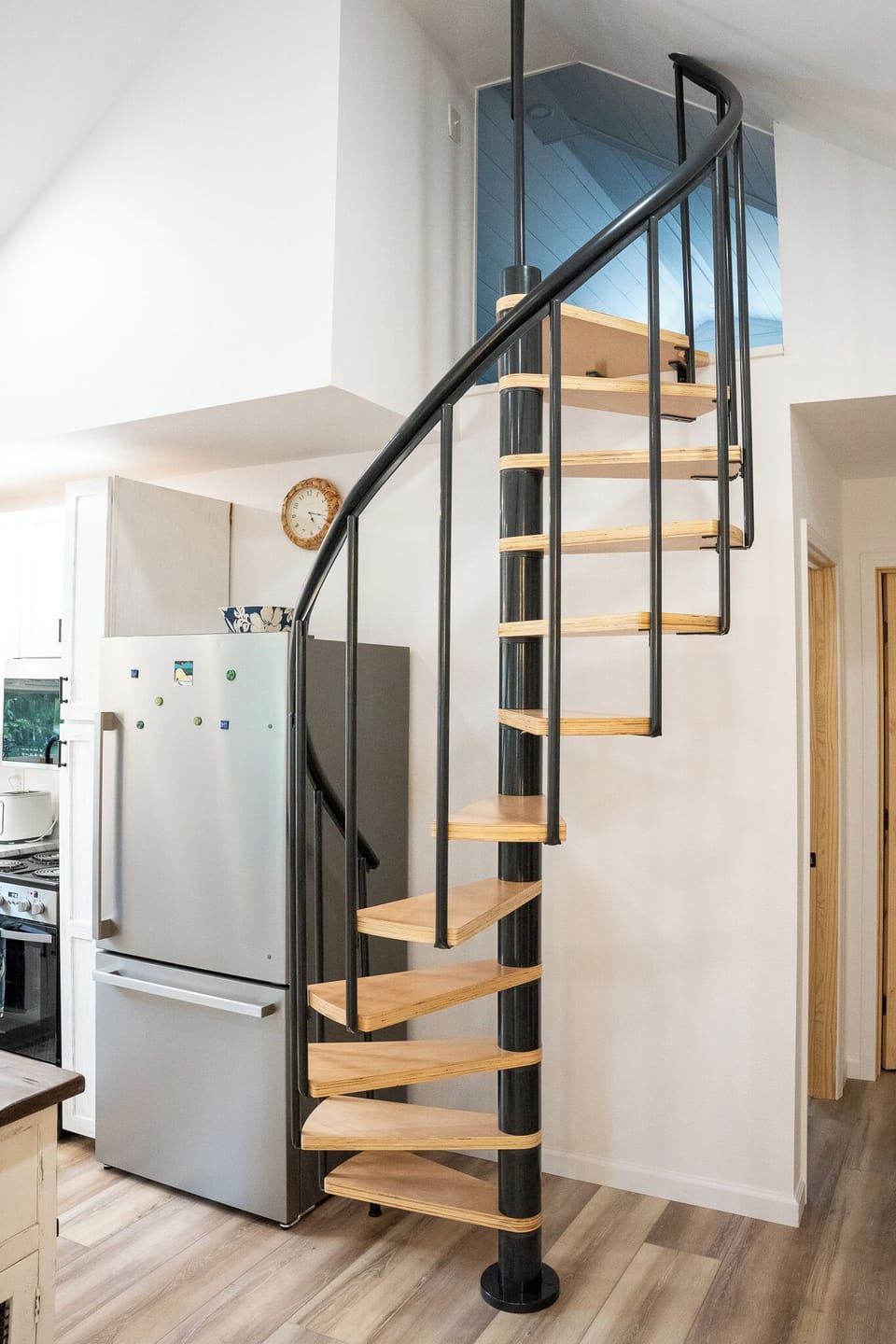 Spiral staircase to a loft bedroom with two twin beds (best suited for children)