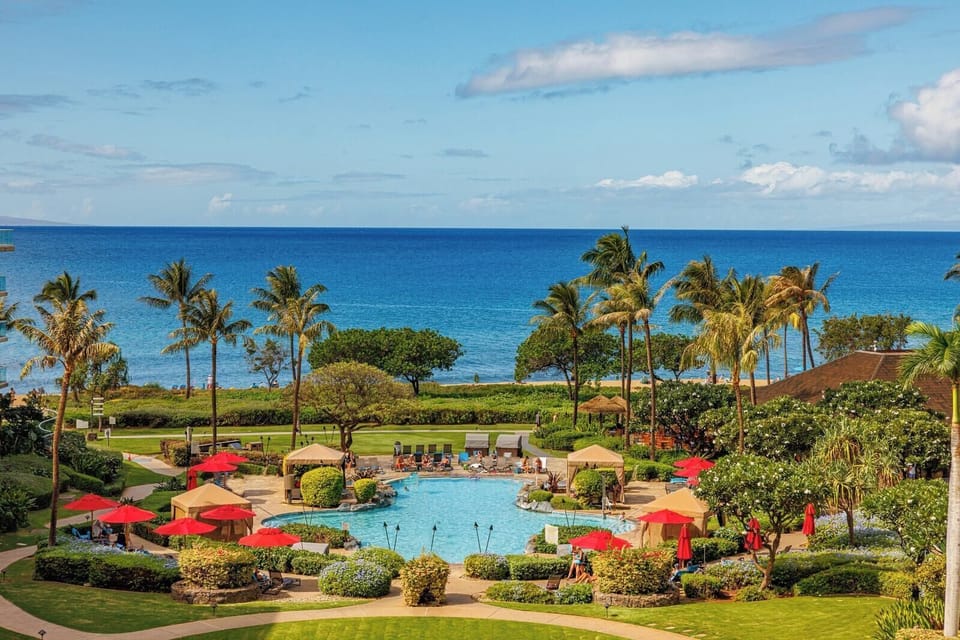 Gaze out over lush tropical gardens and the sparkling resort pool with the ocean just beyond. HKH-529