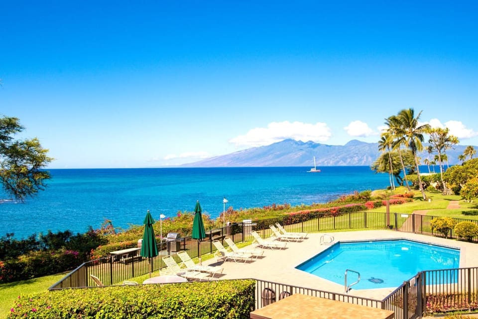  Soak up the sun beside a sparkling oceanfront pool, with stunning views of Molokai across the channel and swaying palms framing the perfect tropical escape. NAP-B43