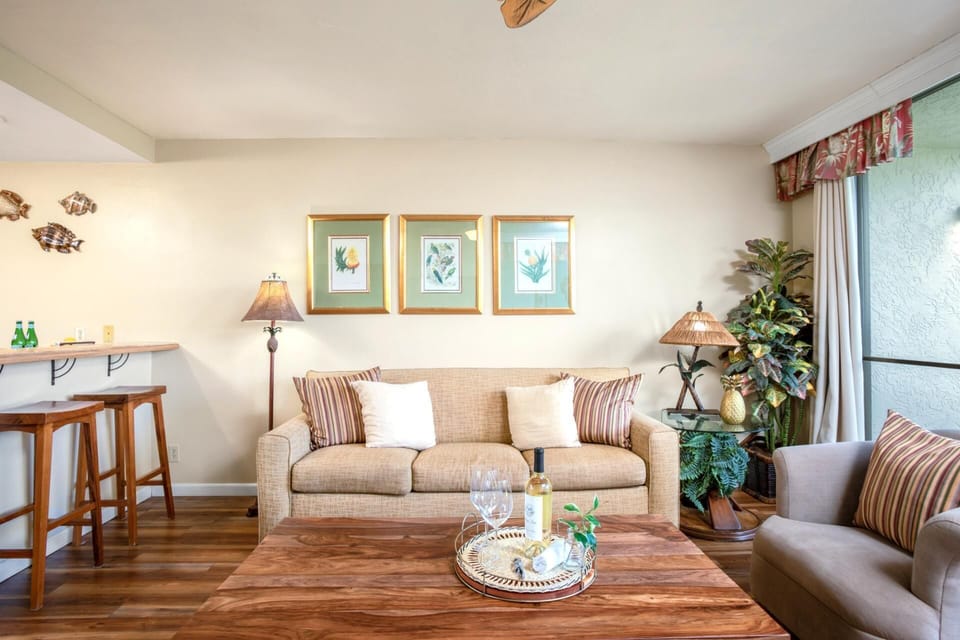 Relax beneath palm-leaf ceiling fans in a sun-drenched space styled with island art, warm wood, and thoughtful touches    NAP-A25