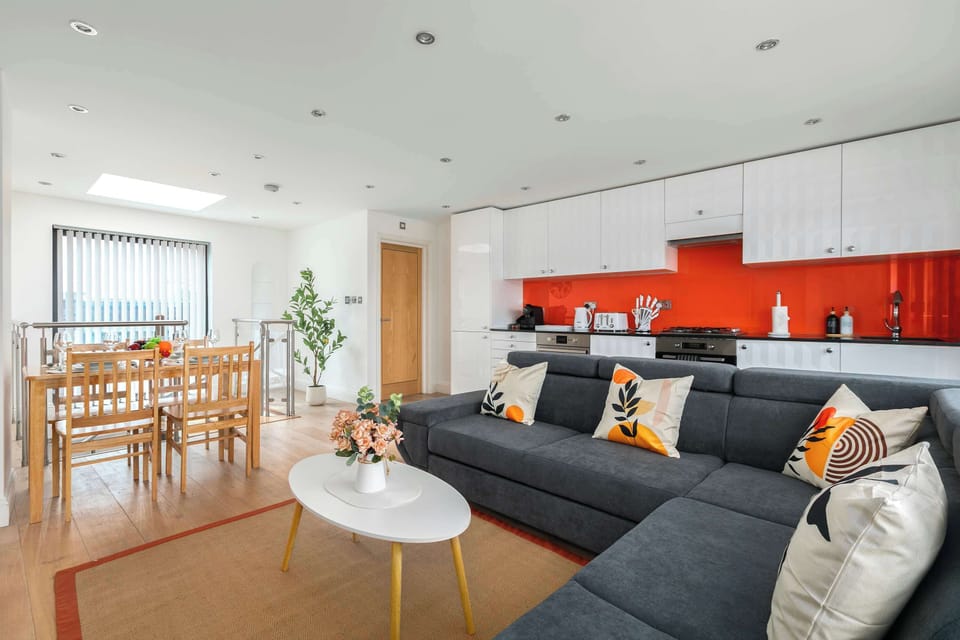 Bright open-plan living, kitchen and dining area, filled with natural light to create a spacious and welcoming atmosphere