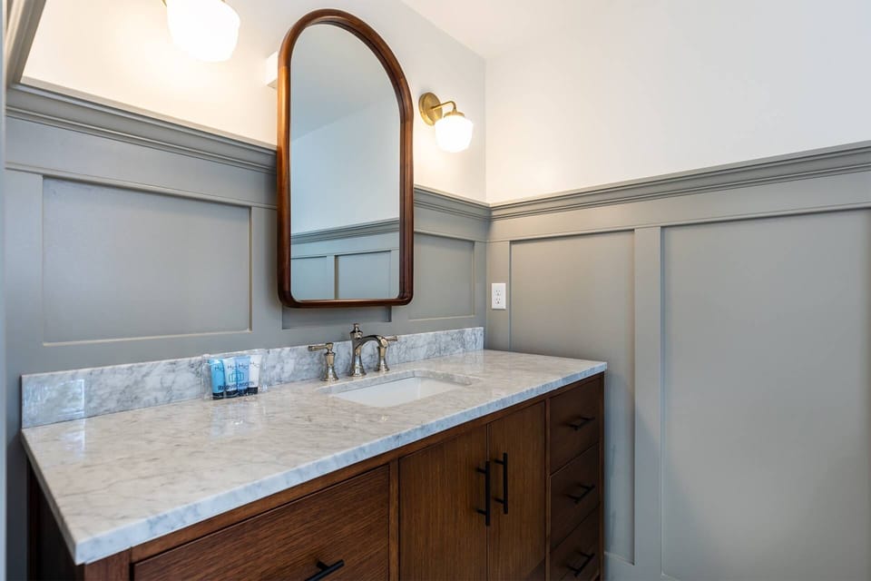 The King Suite luxurious ensuite bath has heated floor tiles and a large vanity.