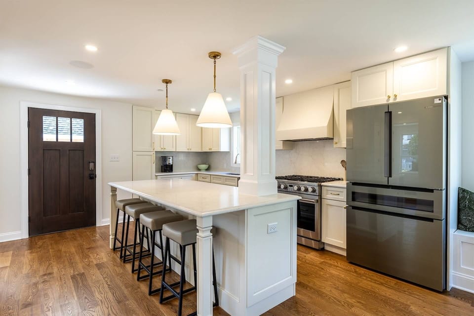 The full kitchen includes all new luxury stainless steel appliances and seating for 4 at the breakfast bar.