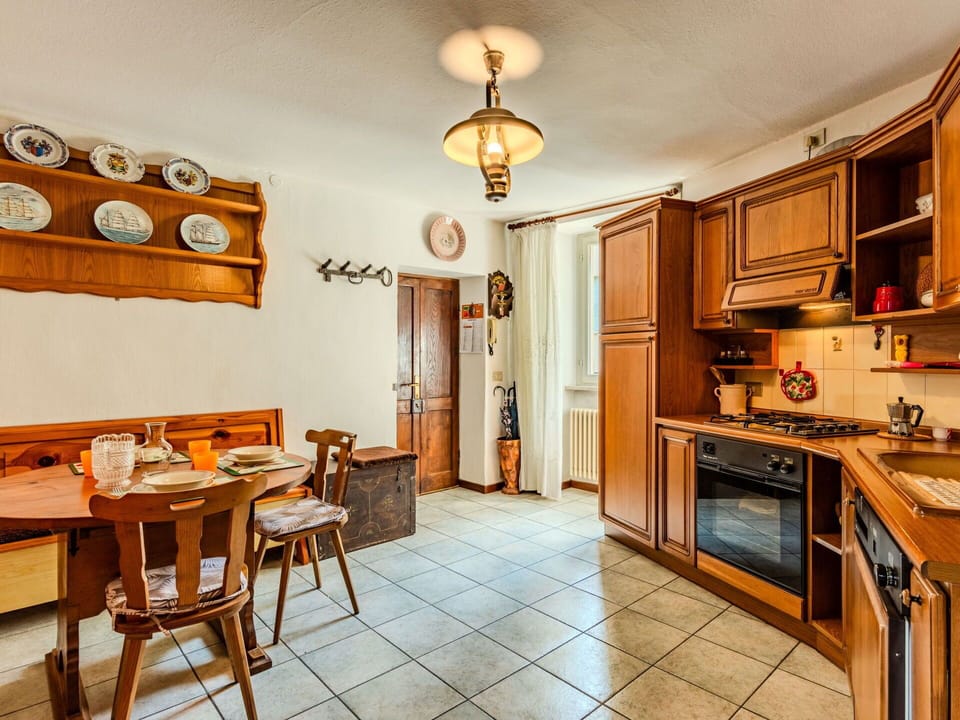 Furniture, Property, Cabinetry, Table, Countertop, Wood, Picture Frame, Kitchen Appliance, Kitchen, Lighting
