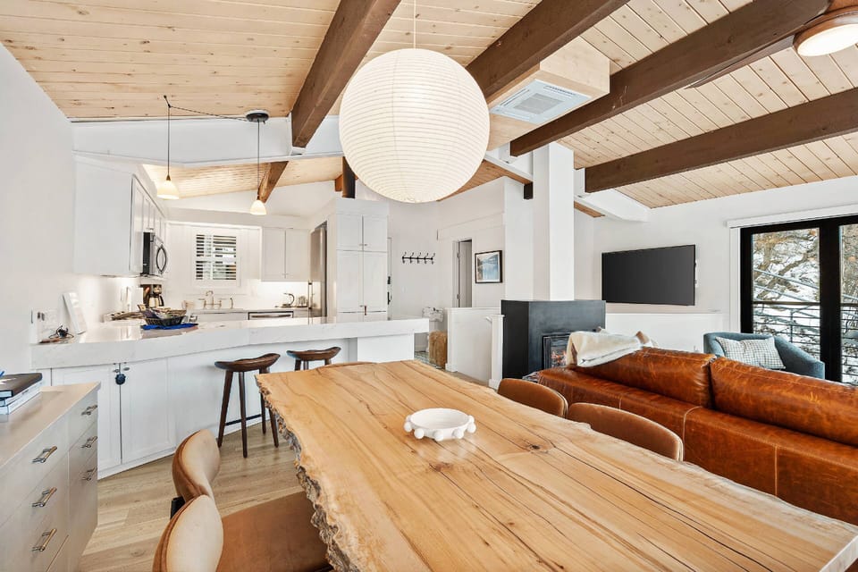 This light and bright modern condo invites you to relax with a neutral color palette and sophisticated designer touches