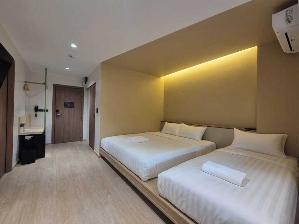 Triple Room, Non Smoking, City View | Desk, free WiFi