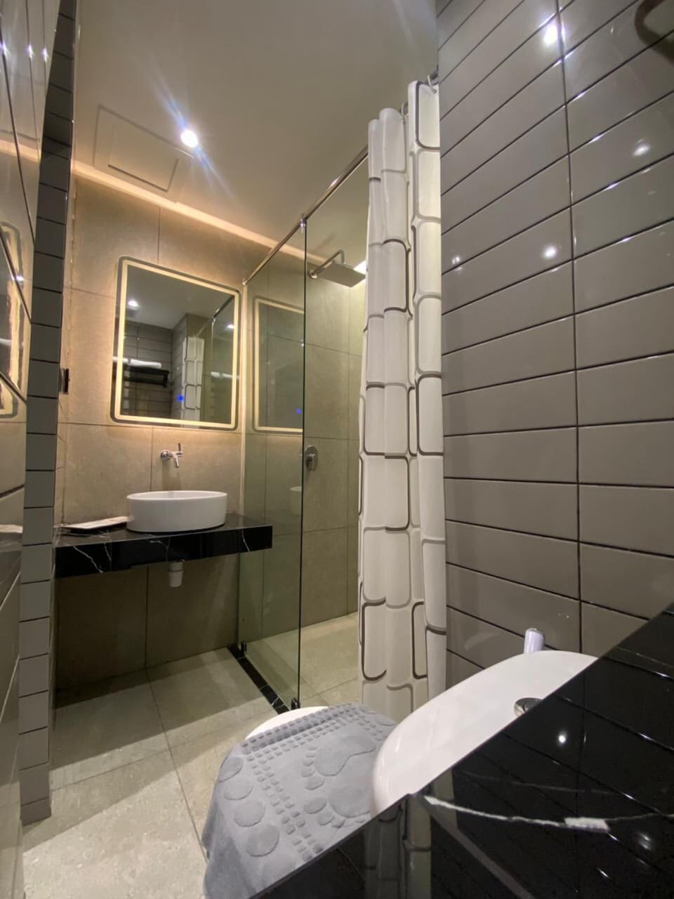 Shower, slippers, towels, soap