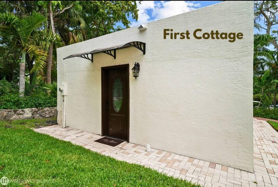 First Cottage - Featuring a charming door and a well-kept pathway, promising a cozy stay.
