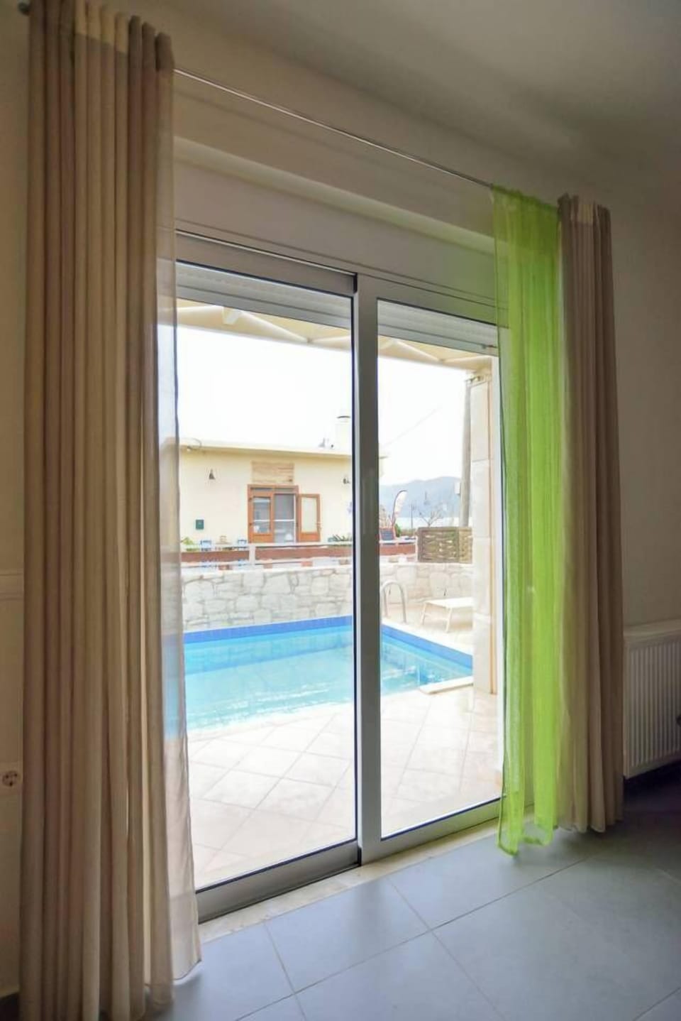 Relax with a Beautiful Pool View from the Living Room
