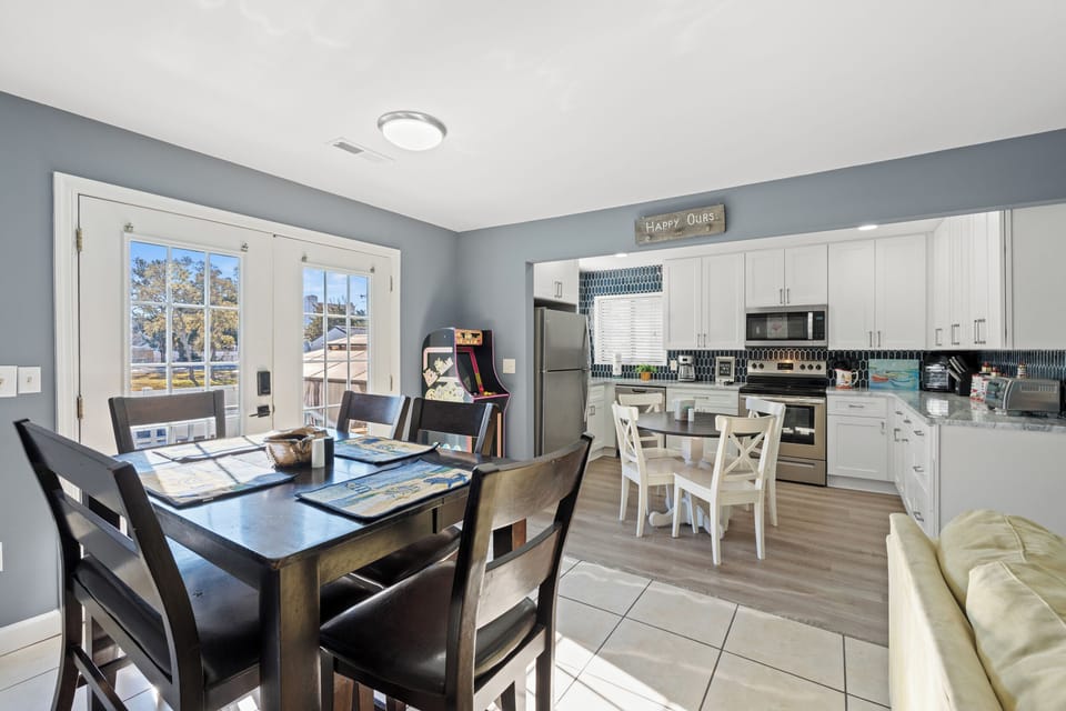 Your open-concept kitchen and dining space invites memorable meals with modern appliances, spacious counters, and room for everyone to gather.
