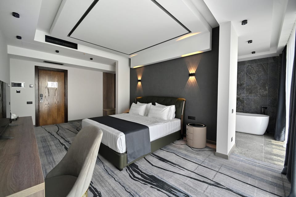 Luxury Double Room, Balcony, Mountain View | In-room safe, blackout drapes, soundproofing, iron/ironing board